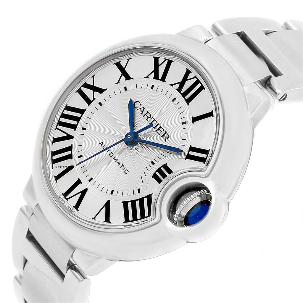This image shows a close-up of the dial, hands, and bracelet of a Cartier Ballon Bleu W6920046 Women
s Stainless Steel Silver Dial W6920046 Women
s Stainless Steel Silver Dial watch, highlighting its crown with a blue cabochon.