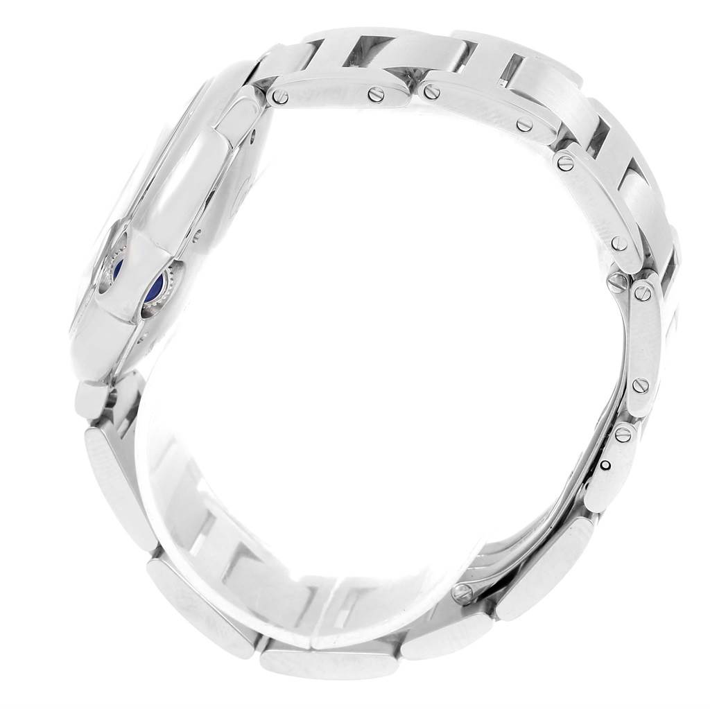 This image shows a side view of the Cartier Ballon Bleu W6920046 Women
s Stainless Steel Silver Dial W6920046 Women
s Stainless Steel Silver Dial watch, highlighting its metallic bracelet and partially visible crown.