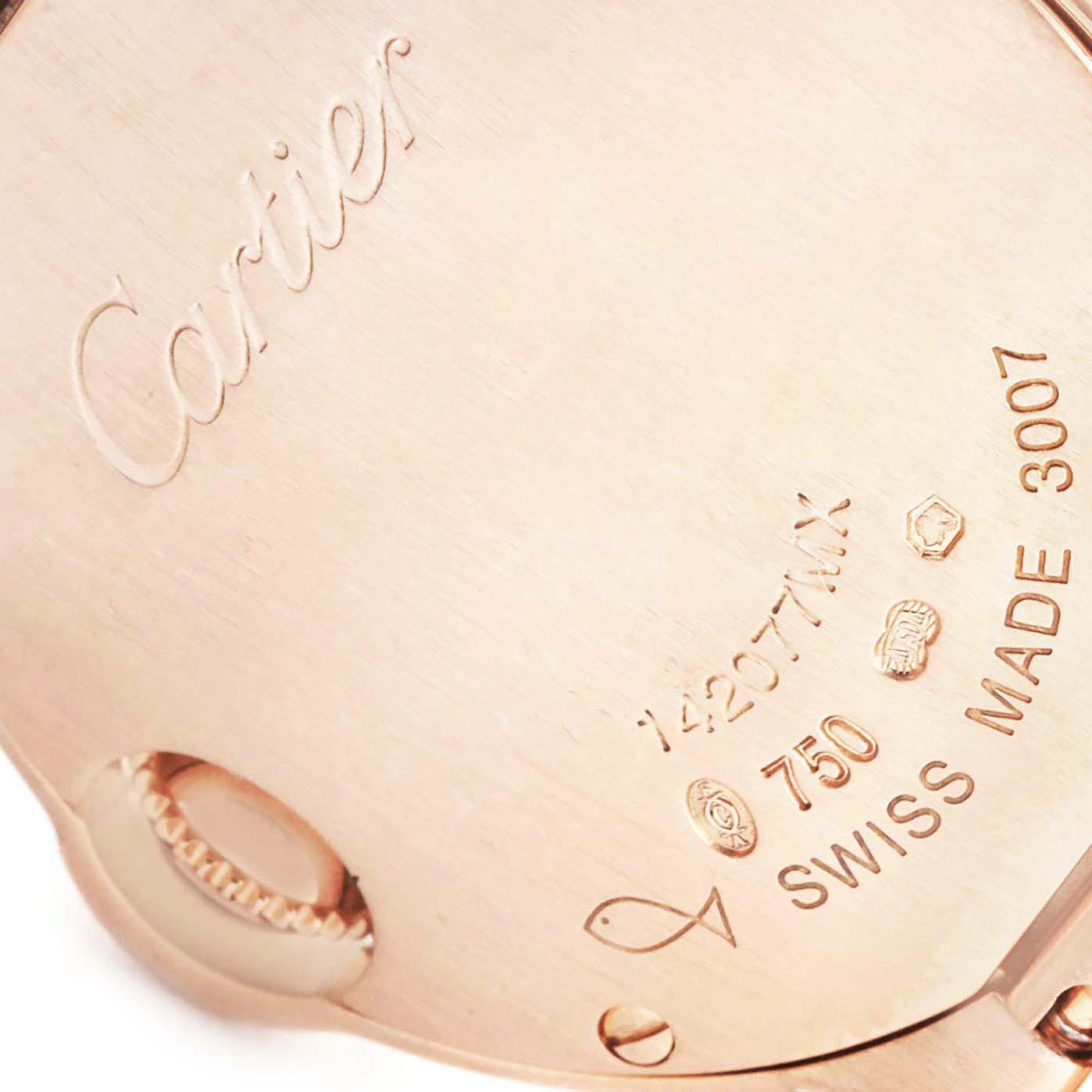 The image shows the back case of a Ballon Bleu de Cartier watch, displaying engravings and hallmark stamps.