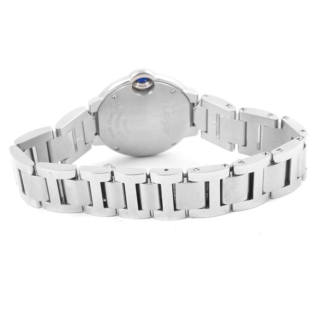 The image shows the back case and metal bracelet of a Cartier Ballon Bleu WE902073 Women
s Stainless Steel Silver Dial WE902073 Women
s Stainless Steel Silver Dial watch.