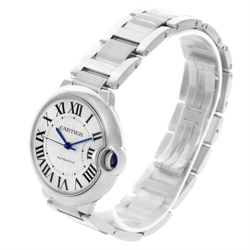 The image shows a side angle of a Cartier Ballon Bleu W6920046 Women
s Stainless Steel Silver Dial W6920046 Women
s Stainless Steel Silver Dial watch, highlighting its bracelet, case, dial, and crown.