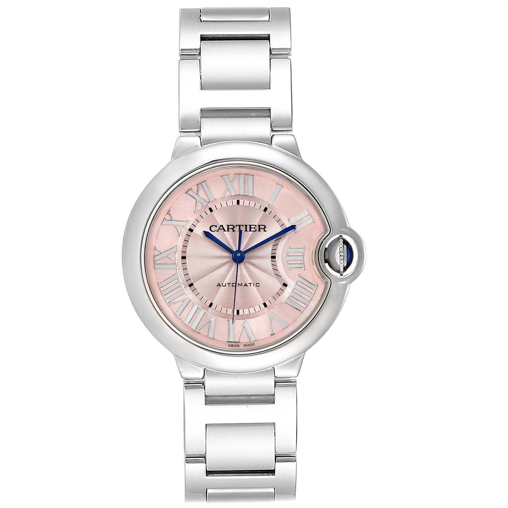 This image shows a Ballon Bleu model watch by Cartier from a front angle, highlighting its pink dial, Roman numerals, and metal bracelet.