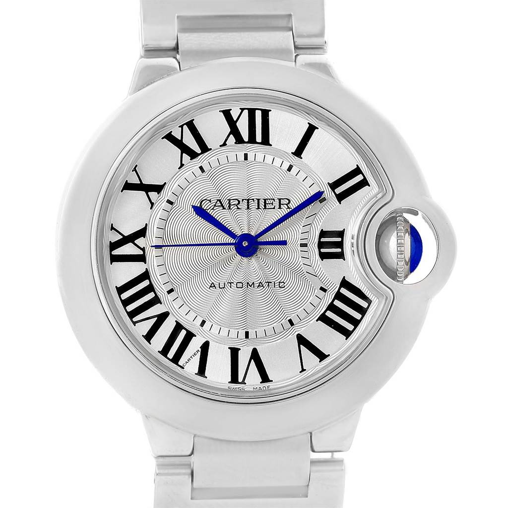 The image shows a front view of the Cartier Ballon Bleu W6920046 Women's Stainless Steel Silver Dial W6920046 Women's Stainless Steel Silver Dial watch featuring its face, Roman numerals, blue hands, and fluted crown.
