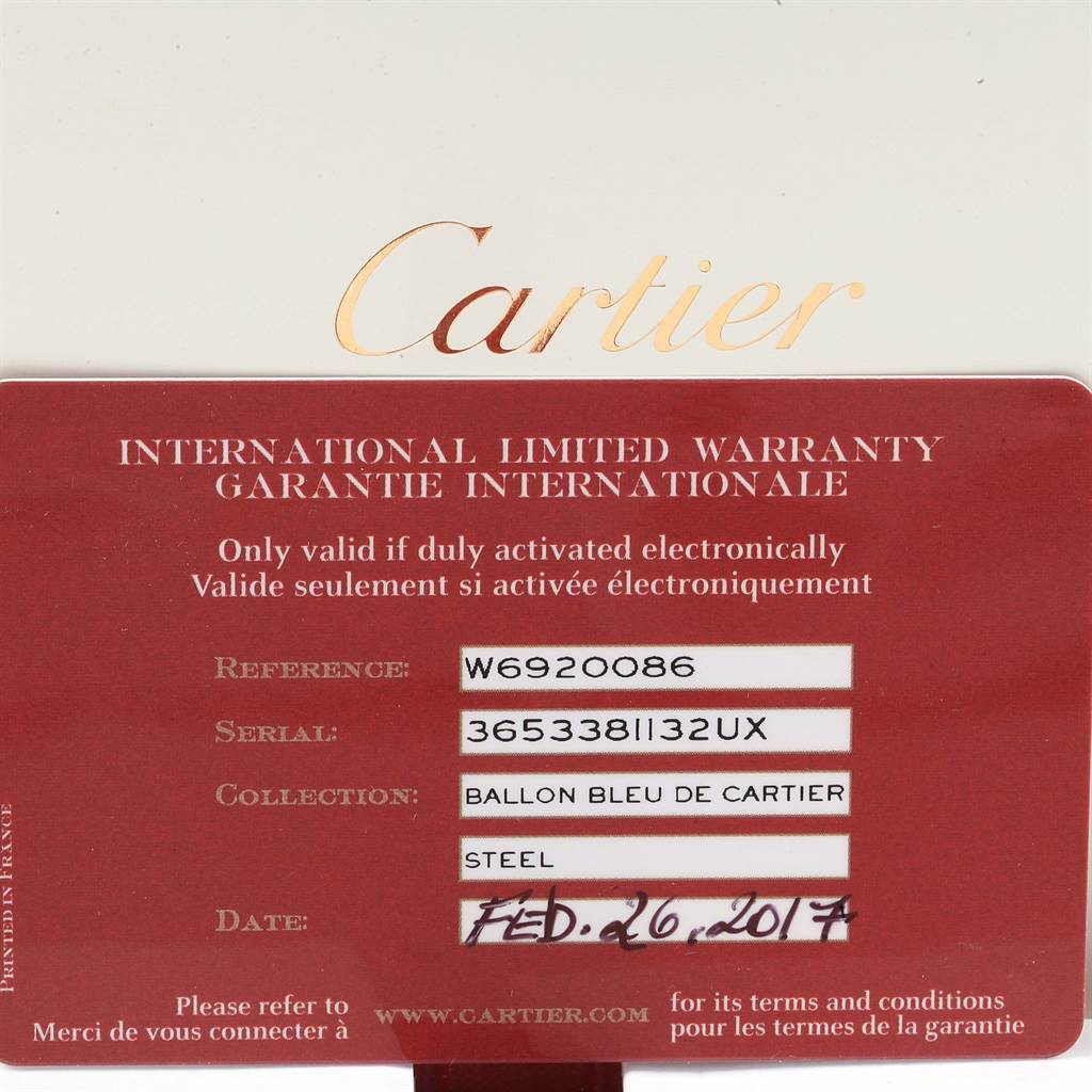 This image shows the international warranty card for a Ballon Bleu de Cartier watch, indicating details like reference, serial number, collection, and date.