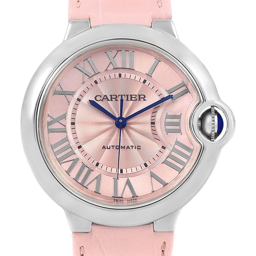 This image shows a front view of a Cartier Ballon Bleu WSBB0007 Women
s Stainless Steel Pink Dial WSBB0007 Women
s Stainless Steel Pink Dial watch, highlighting the pink dial, Roman numerals, blue hands, and crown.