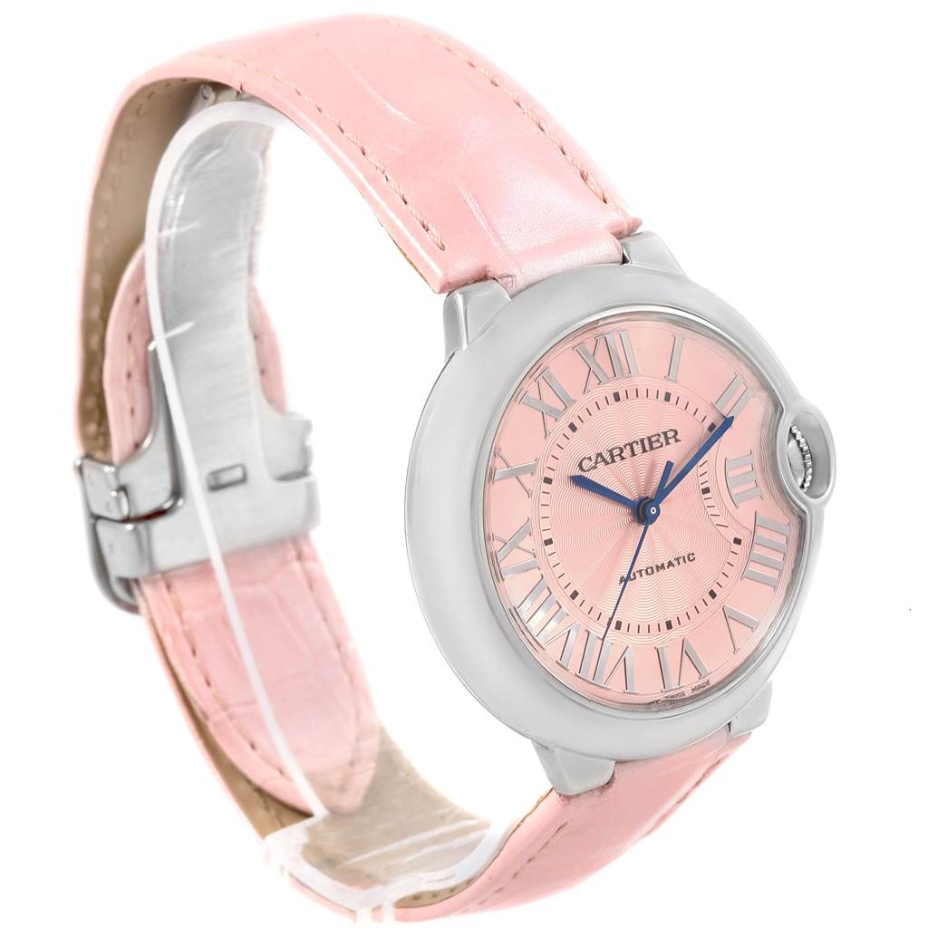 The image shows a Cartier Ballon Bleu WSBB0007 Women
s Stainless Steel Pink Dial WSBB0007 Women
s Stainless Steel Pink Dial model watch from a three-quarter angle, highlighting its pink strap and dial.