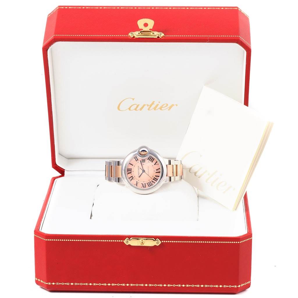 The Cartier Ballon Bleu W6920098 Women's Steel and Gold (two tone) Mother of Pearl Dial W6920098 Women's Steel and Gold (two tone) Mother of Pearl Dial watch is shown from the front, displayed in its open red box with accompanying documents.