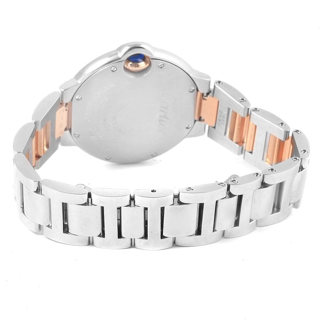 The image shows the back view and bracelet of a Ballon Bleu de Cartier watch, highlighting its metallic links and clasp.