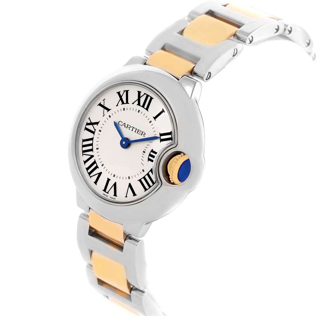 This angled view of the Cartier Ballon Bleu W69007Z3 Women's Stainless Steel Silver Dial W69007Z3 Women's Stainless Steel Silver Dial watch shows its face, Roman numeral markers, blue hands, and bicolor bracelet.