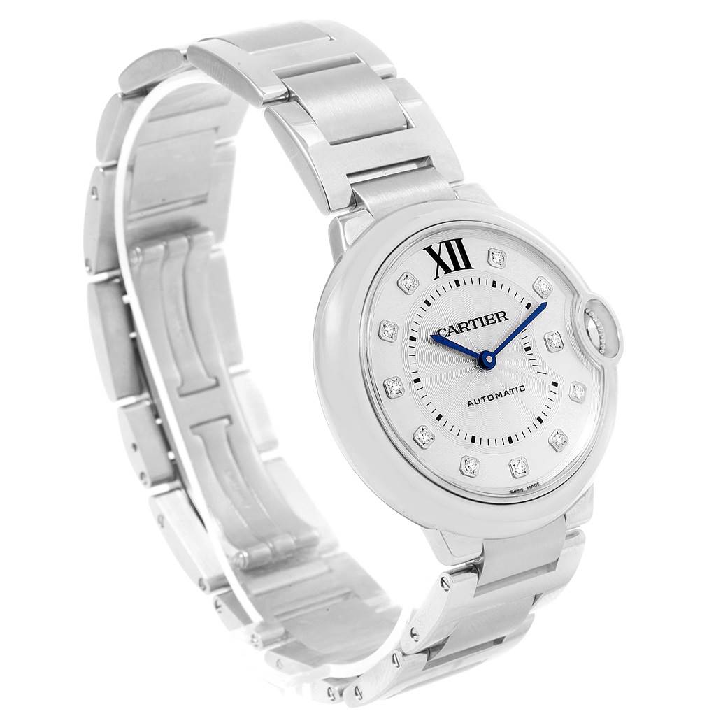 The image shows a Cartier Ballon Bleu WE902075 Women
s Stainless Steel Silver Dial WE902075 Women
s Stainless Steel Silver Dial watch angled to display its face and part of its metal bracelet.