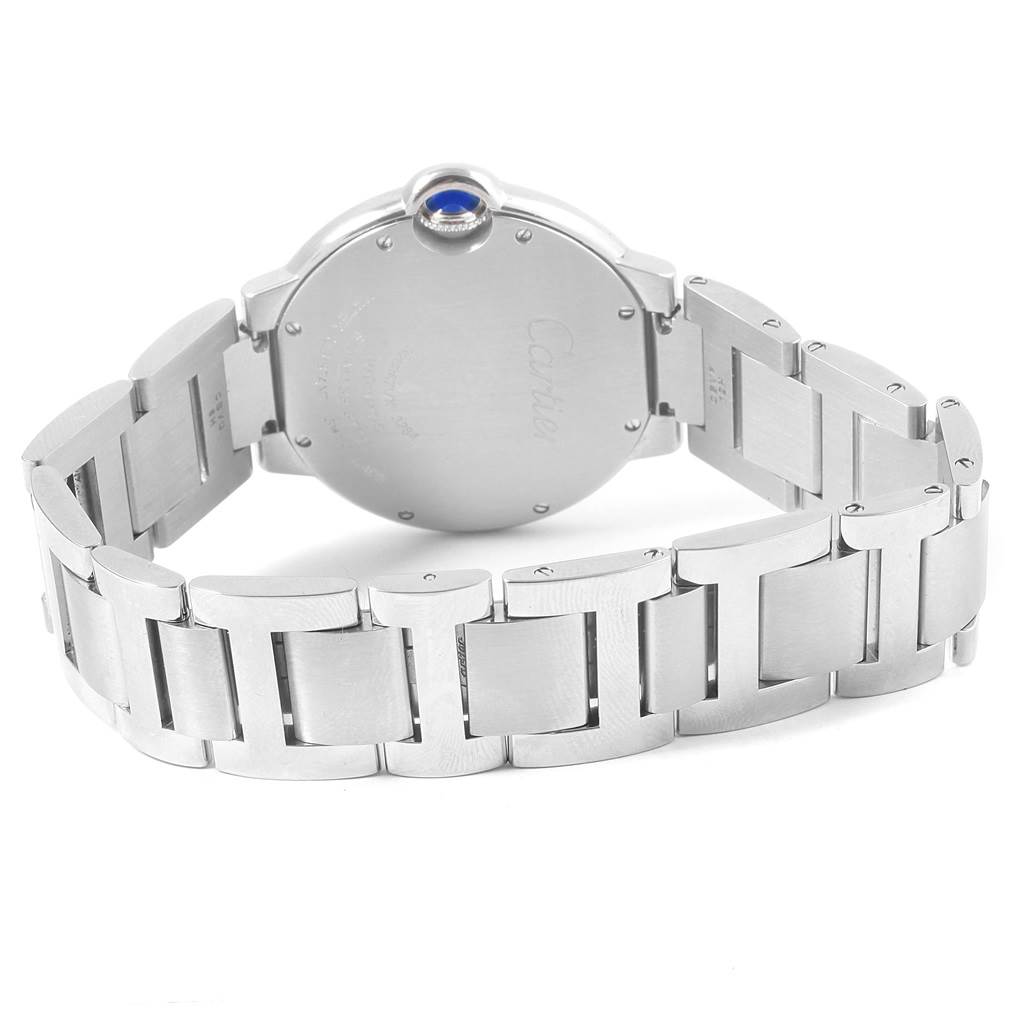 The image shows the back and metal bracelet of the Ballon Bleu de Cartier watch, highlighting its clasp and crown.