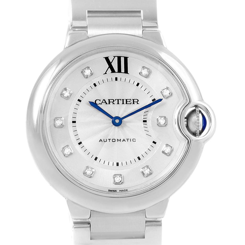 The image shows a front view of the Cartier Ballon Bleu WE902075 Women
s Stainless Steel Silver Dial WE902075 Women
s Stainless Steel Silver Dial watch, featuring its dial, hands, and bracelet.