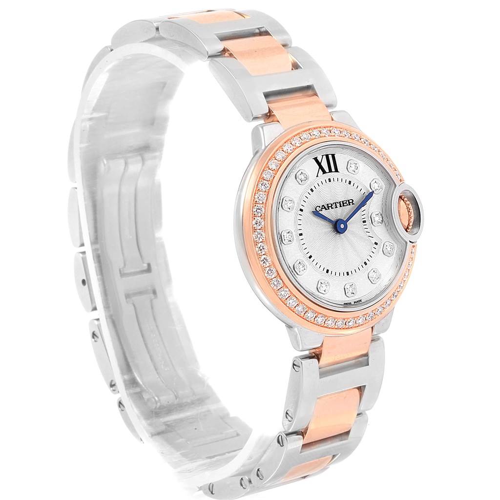 This image shows a side and front angle of the Cartier Ballon Bleu WE902076 Women
s Steel and Gold (two tone) Silver Dial WE902076 Women
s Steel and Gold (two tone) Silver Dial watch, highlighting its bracelet, bezel, and dial.