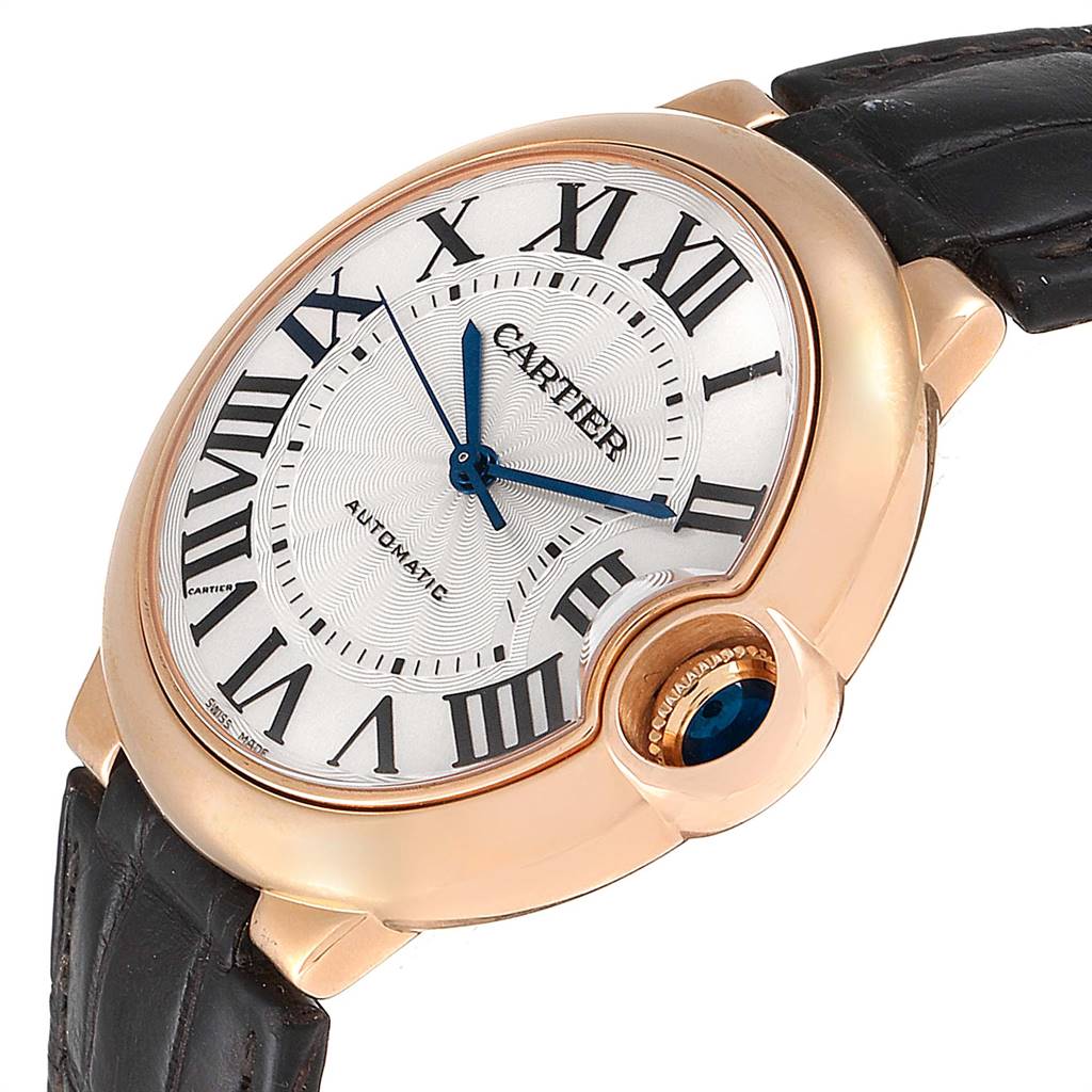 This image shows a close-up of the Cartier Ballon Bleu WGBB0009 Men's Rose Gold Silver Dial WGBB0009 Men's Rose Gold Silver Dial watch face, focusing on the dial, hands, Roman numerals, crown, and partial watch strap.