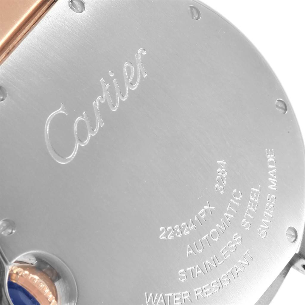 The image shows the back case of a Cartier Ballon Bleu W6920070 Women's Steel and Gold (two tone) Mother of Pearl Dial W6920070 Women's Steel and Gold (two tone) Mother of Pearl Dial watch, highlighting the engraved details and the crown.