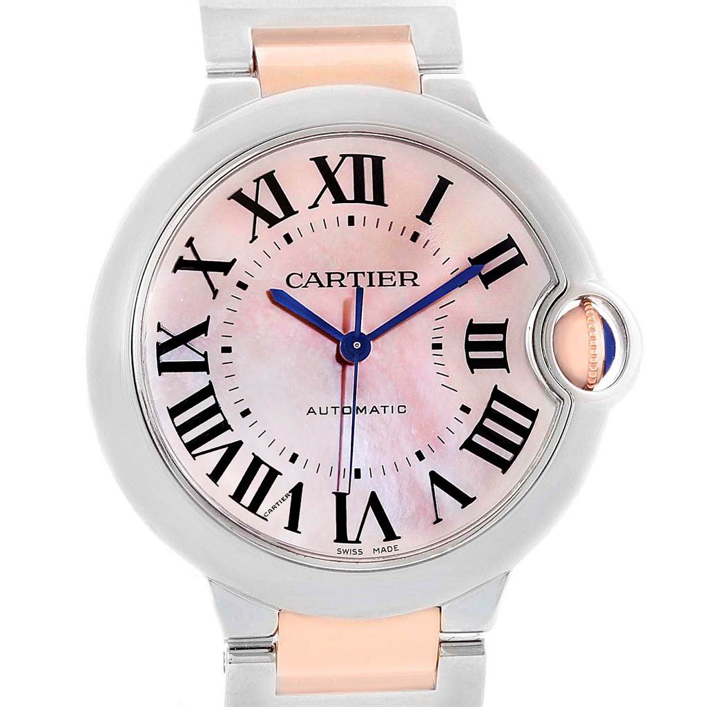 This is a front view of a Cartier Ballon Bleu W6920070 Women's Steel and Gold (two tone) Mother of Pearl Dial W6920070 Women's Steel and Gold (two tone) Mother of Pearl Dial watch, showing the face, Roman numerals, blue hands, and part of the bracelet.