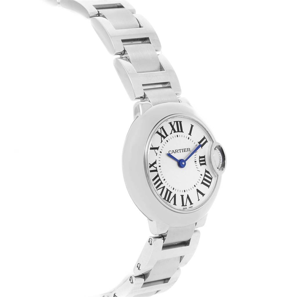 The image shows a side angle of a Ballon Bleu model by Cartier, highlighting its dial, bracelet, and crown.