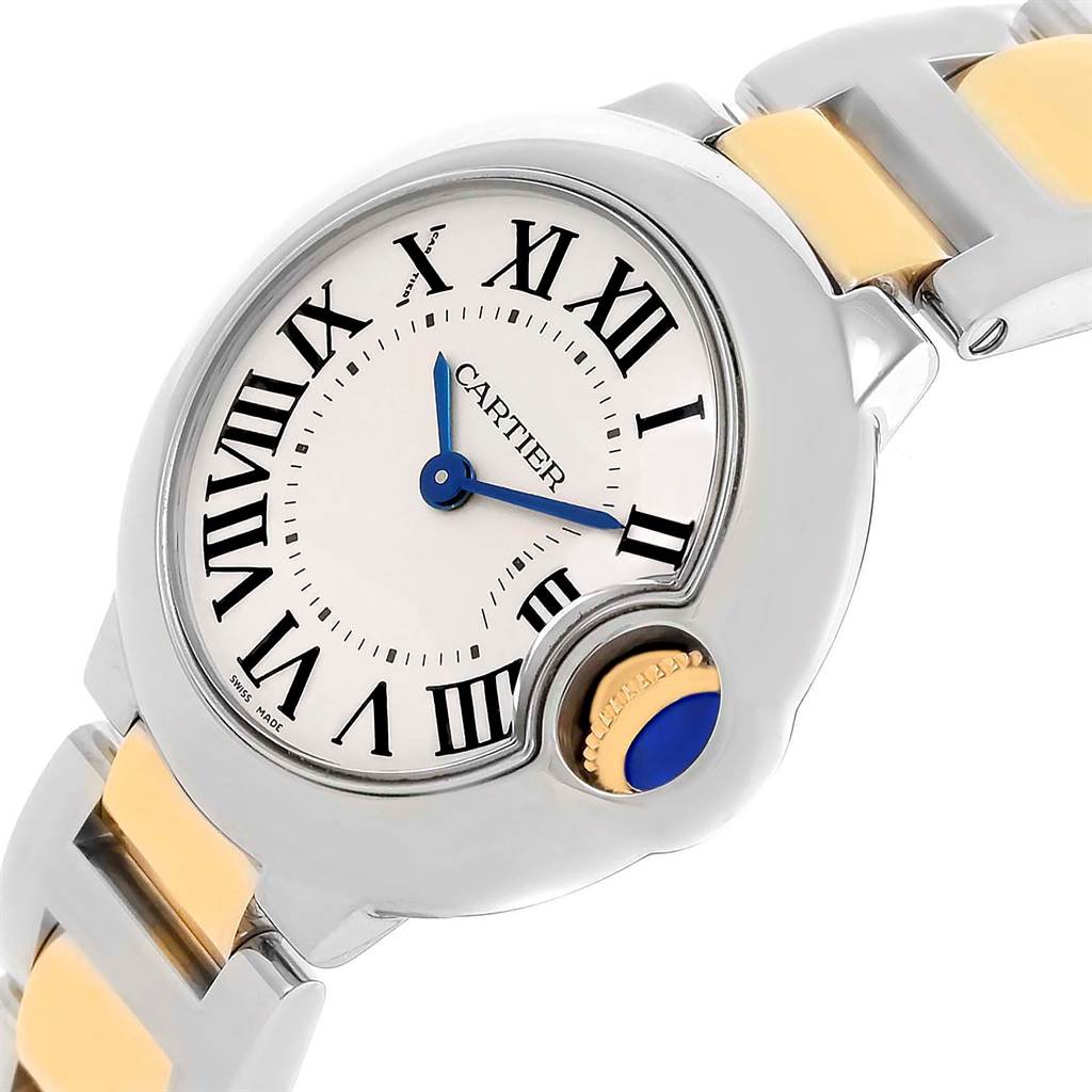 The Ballon Bleu by Cartier is shown at an oblique angle, highlighting the face, Roman numerals, hands, and part of the bracelet.