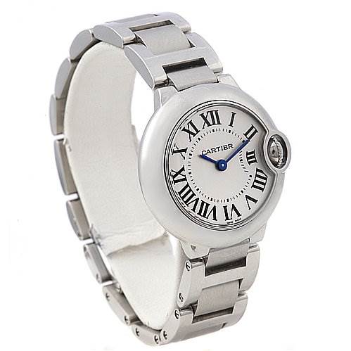 The image shows a Ballon Bleu watch by Cartier at a three-quarter angle, highlighting the face, Roman numerals, and metal bracelet.