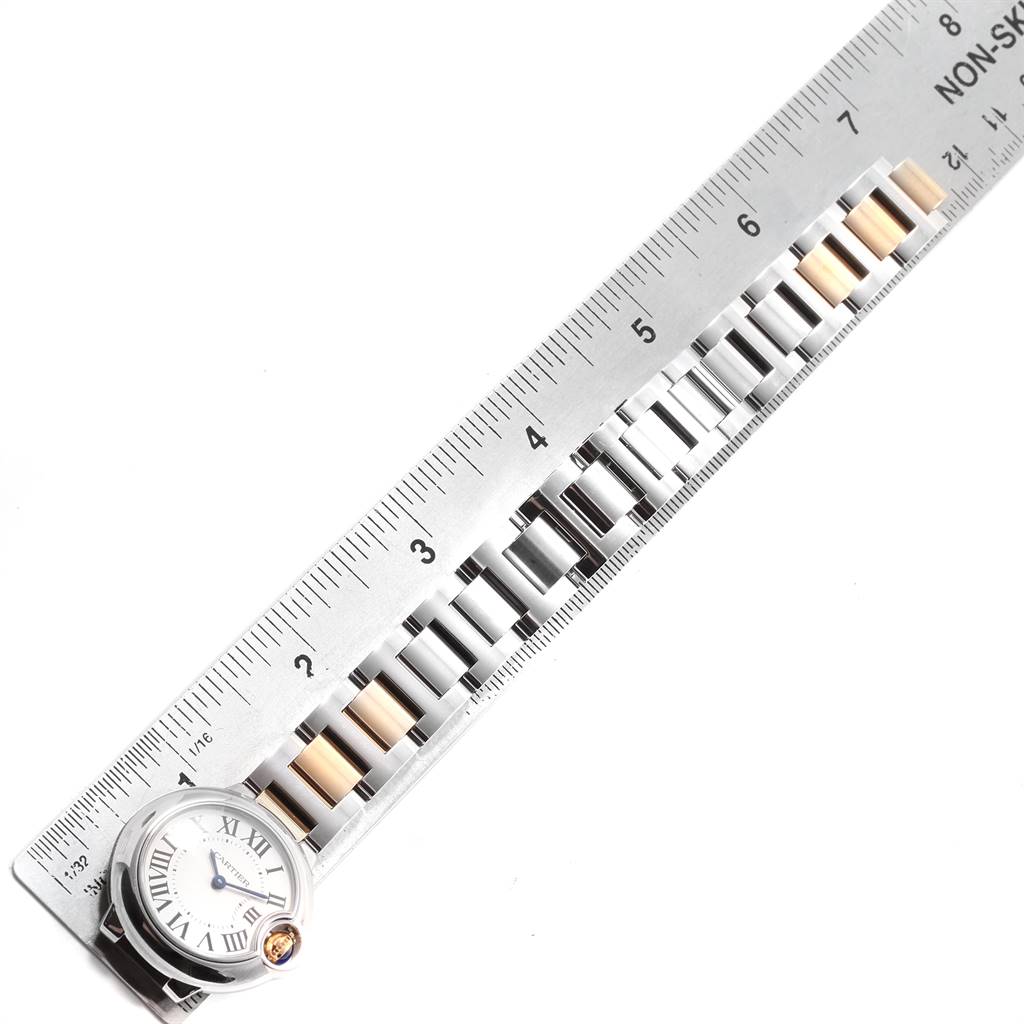 The image shows a Cartier Ballon Bleu W69007Z3 Women's Steel and Gold (two tone) Silver Dial W69007Z3 Women's Steel and Gold (two tone) Silver Dial watch bracelet and case next to a ruler, displaying a measurement of the bracelet links.