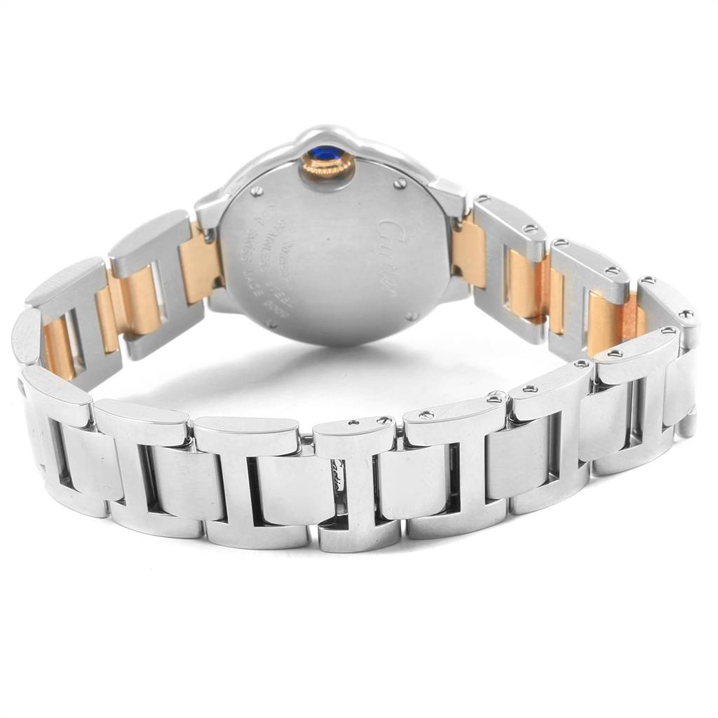 The image shows the back and bracelet of the Ballon Bleu de Cartier watch, highlighting its metal links and clasp.