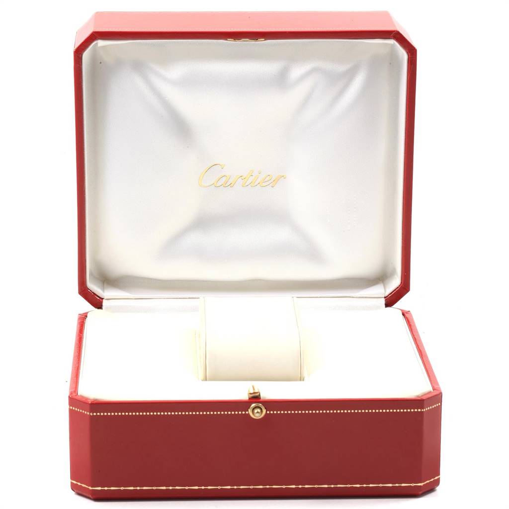 The image shows an open, red Cartier watch box for the Ballon Bleu model, displaying an elegant interior with a cushion.