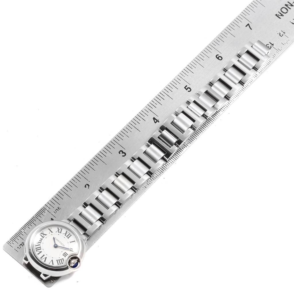 The image shows a Cartier Ballon Bleu W69010Z4 Women
s Stainless Steel Silver Dial W69010Z4 Women
s Stainless Steel Silver Dial watch, displayed alongside a ruler with its face and metal bracelet visible.