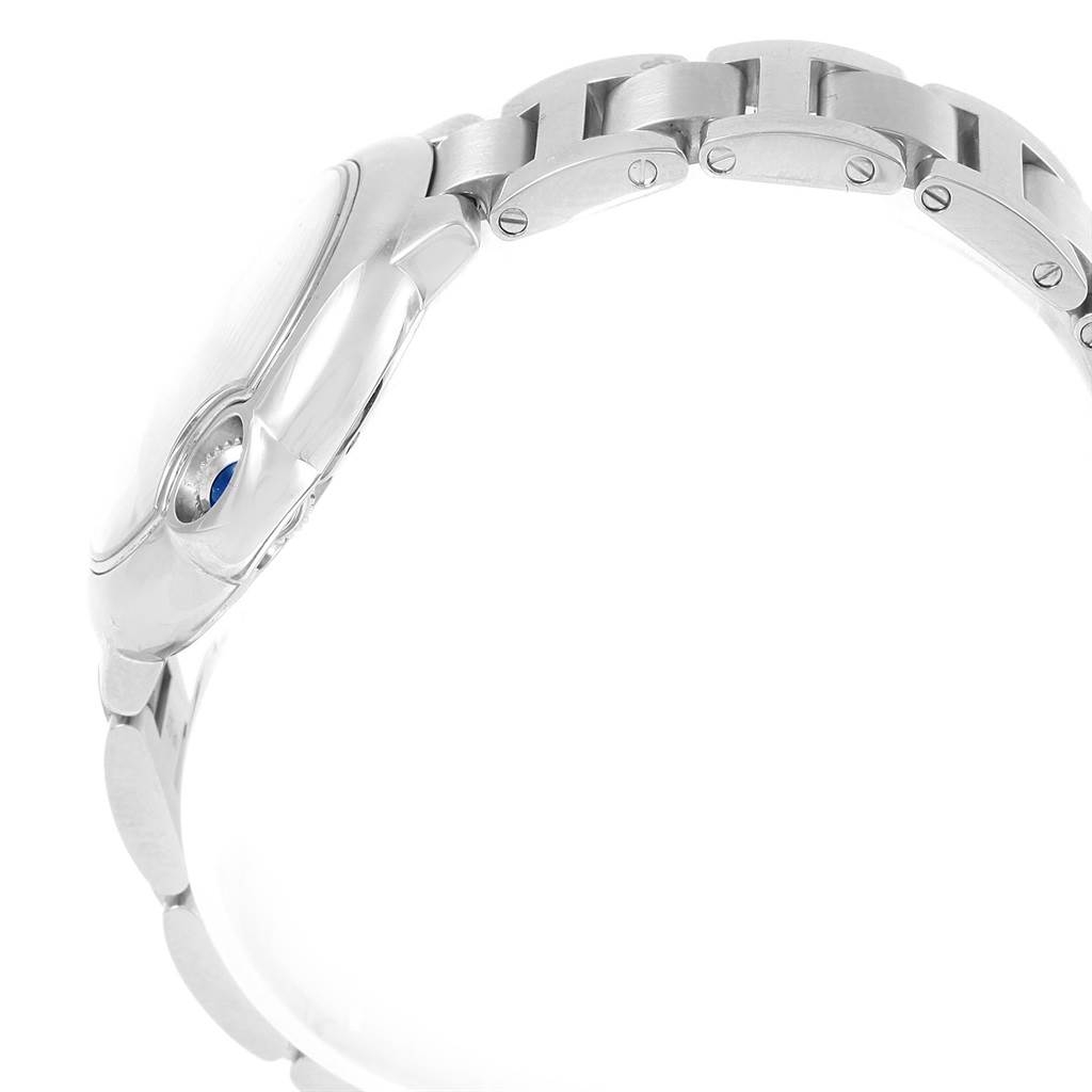 The image shows a side view of the Ballon Bleu de Cartier watch, focusing on the bracelet and crown.