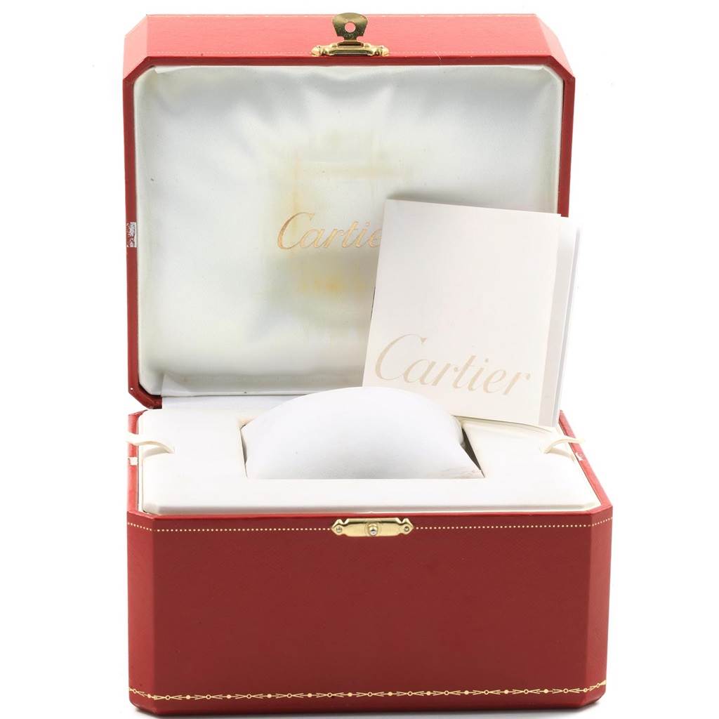 The image shows a red Cartier watch box for the Ballon Bleu model along with Cartier documentation inside.