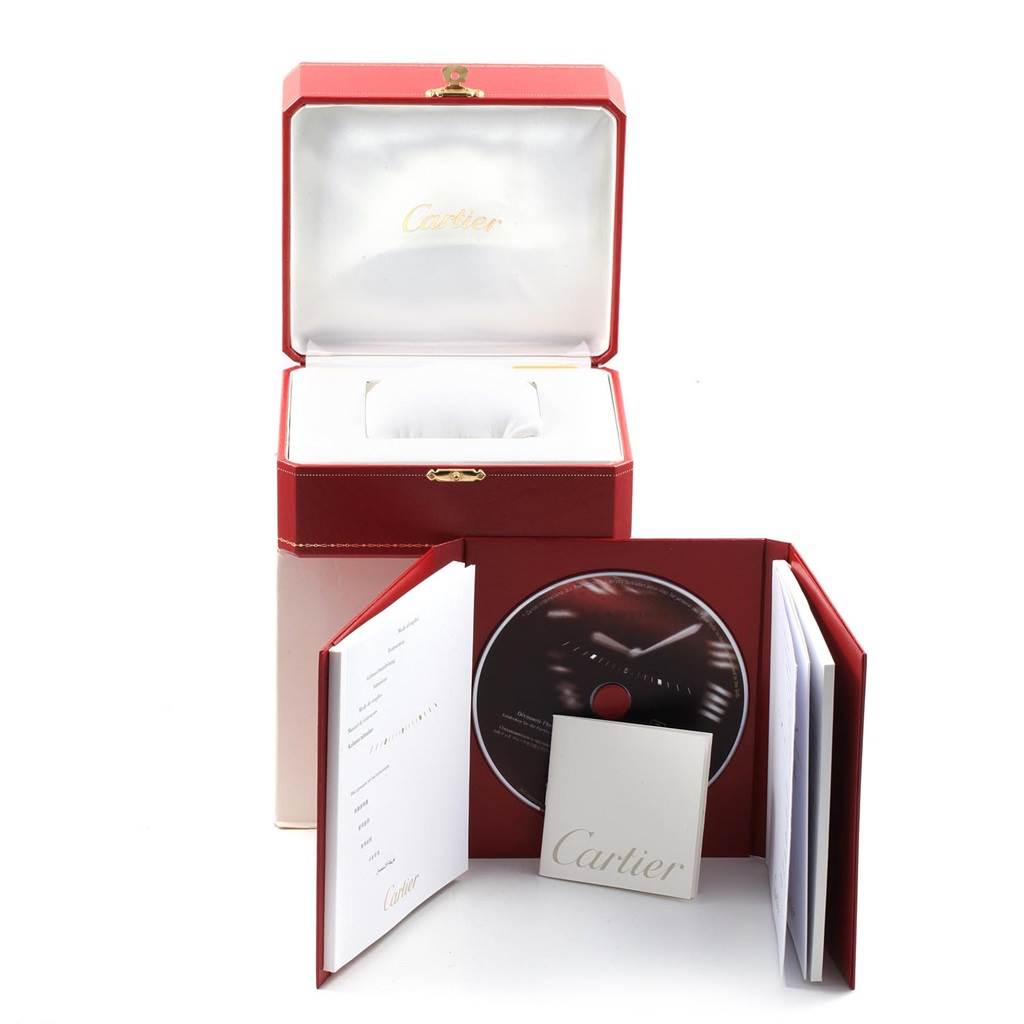 The image shows the red packaging box and accessories for a Cartier Ballon Bleu W69008Z3 Men
s Steel and Gold (two tone) Silver Dial W69008Z3 Men
s Steel and Gold (two tone) Silver Dial watch, including a CD and booklets.