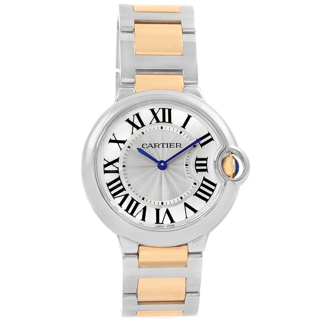 The image shows a front view of the Cartier Ballon Bleu W69008Z3 Men
s Steel and Gold (two tone) Silver Dial W69008Z3 Men
s Steel and Gold (two tone) Silver Dial watch, featuring a silver dial, Roman numerals, and a two-tone metal strap.