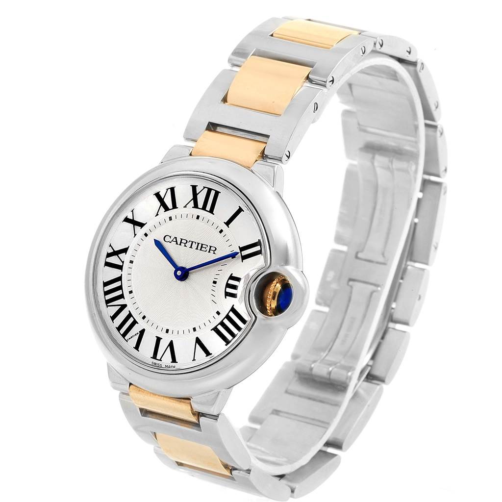 The image shows a Cartier Ballon Bleu W69008Z3 Men
s Steel and Gold (two tone) Silver Dial W69008Z3 Men
s Steel and Gold (two tone) Silver Dial watch at a slight angle displaying the face, blue hands, and the metal band.