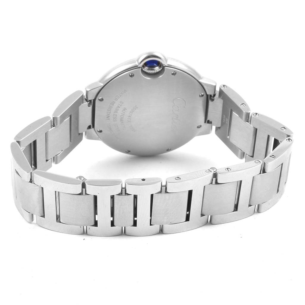 This image shows the back and bracelet of a Cartier Ballon Bleu W6920046 Women
s Stainless Steel Silver Dial W6920046 Women
s Stainless Steel Silver Dial watch, highlighting its stainless steel links and crown with a blue cabochon.