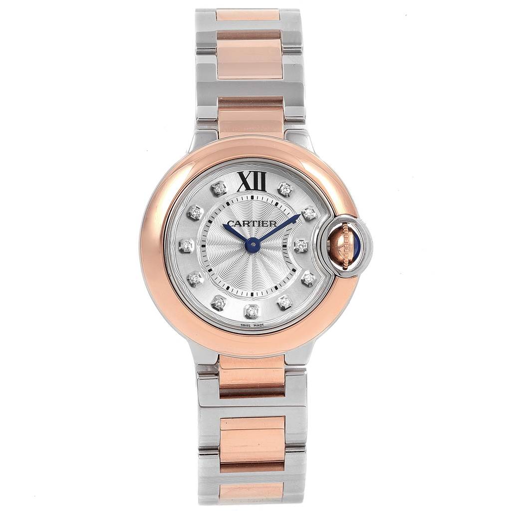 The image shows a front view of a Cartier Ballon Bleu W3BB0005 Women
s Steel and Gold (two tone) Silver Dial W3BB0005 Women
s Steel and Gold (two tone) Silver Dial watch, featuring a two-tone metal bracelet and a round face with Roman numerals and diamond markers.