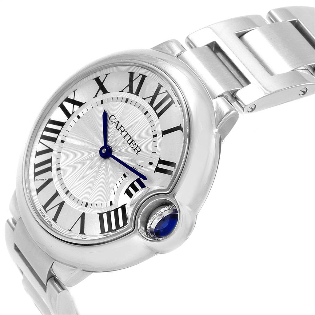 The image shows a close-up angle of the Cartier Ballon Bleu W69011Z4 Women
s Stainless Steel Silver Dial W69011Z4 Women
s Stainless Steel Silver Dial watch, focusing on the face, Roman numerals, blue hands, and metal bracelet.