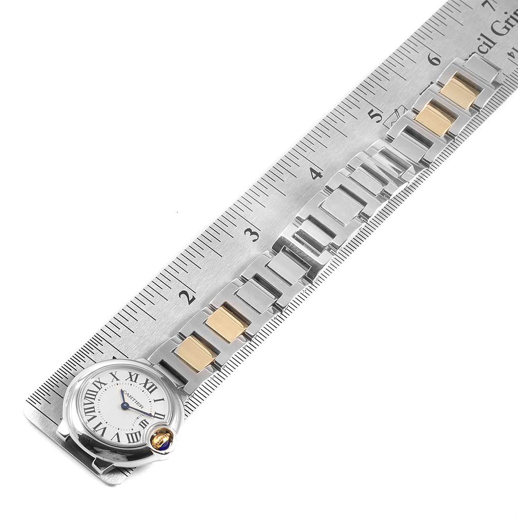 The image shows an overhead view of the dial and bracelet of a Cartier Ballon Bleu W69007Z3 Women's Stainless Steel Silver Dial W69007Z3 Women's Stainless Steel Silver Dial watch placed next to a ruler.
