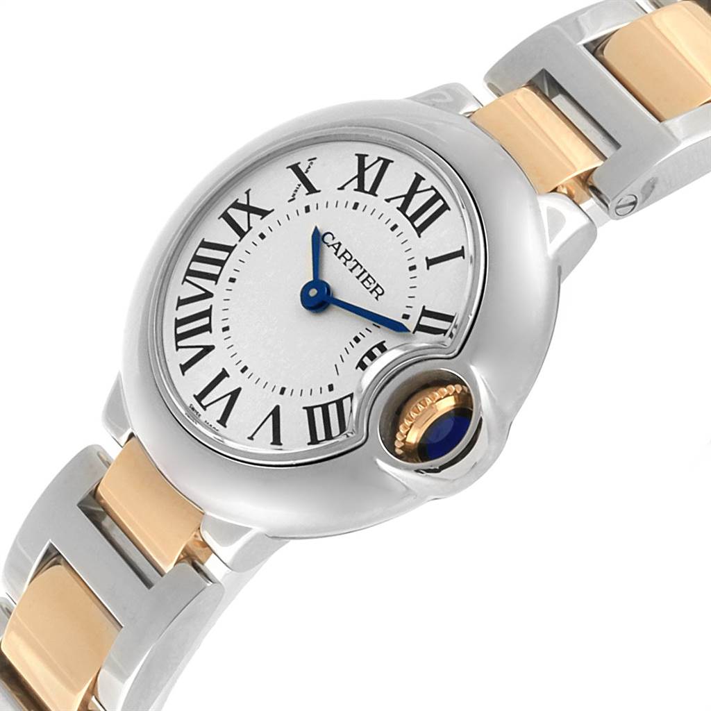 The image displays a close-up of the Cartier Ballon Bleu W69007Z3 Women's Stainless Steel Silver Dial W69007Z3 Women's Stainless Steel Silver Dial watch showing the face, Roman numerals, blue hands, and part of the two-tone metal strap.