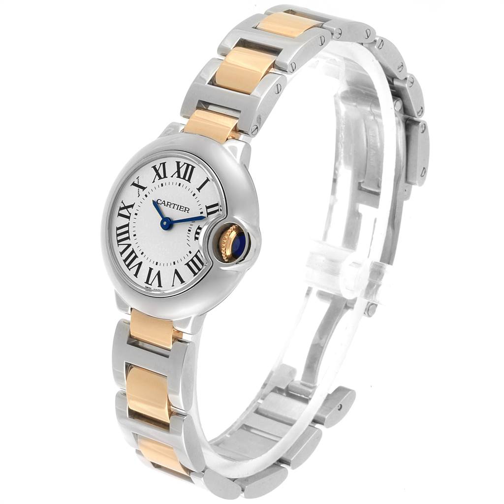 The image shows a side angle of the Ballon Bleu by Cartier, including its Roman numeral dial, two-tone bracelet, and blue gemstone crown.