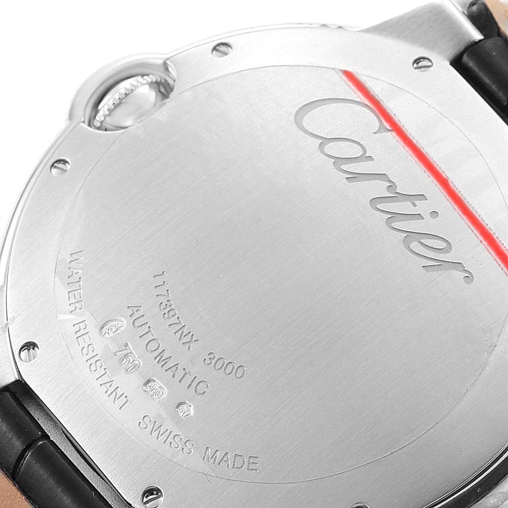 This image shows the back case of a Cartier Ballon Bleu WJBB0032 Women
s White Gold Silver Dial WJBB0032 Women
s White Gold Silver Dial watch, displaying engravings and part of the leather strap with the crown visible.