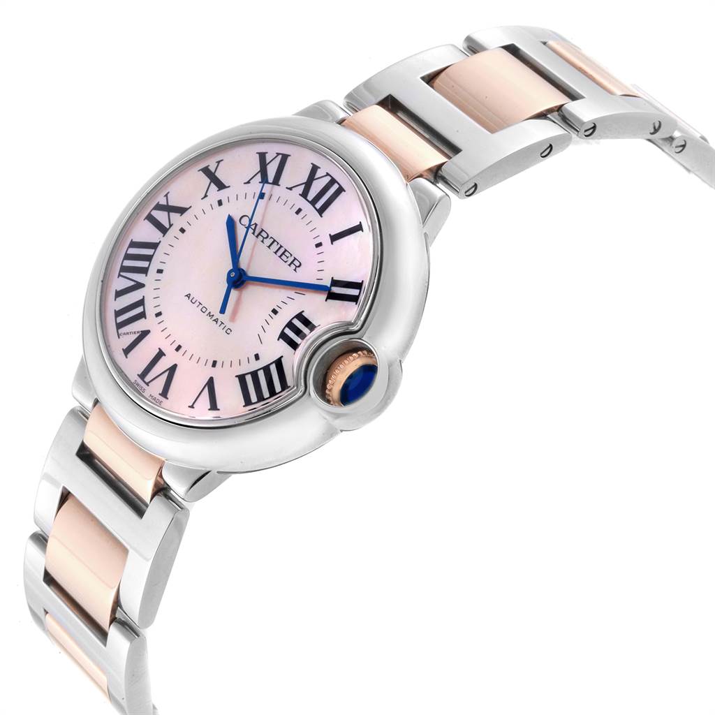 The image shows a top-angle view of a Cartier Ballon Bleu W2BB0011 Women's Steel and Gold (two tone) Mother of Pearl Dial W2BB0011 Women's Steel and Gold (two tone) Mother of Pearl Dial watch, highlighting the face, bezel, crown, and part of the band.