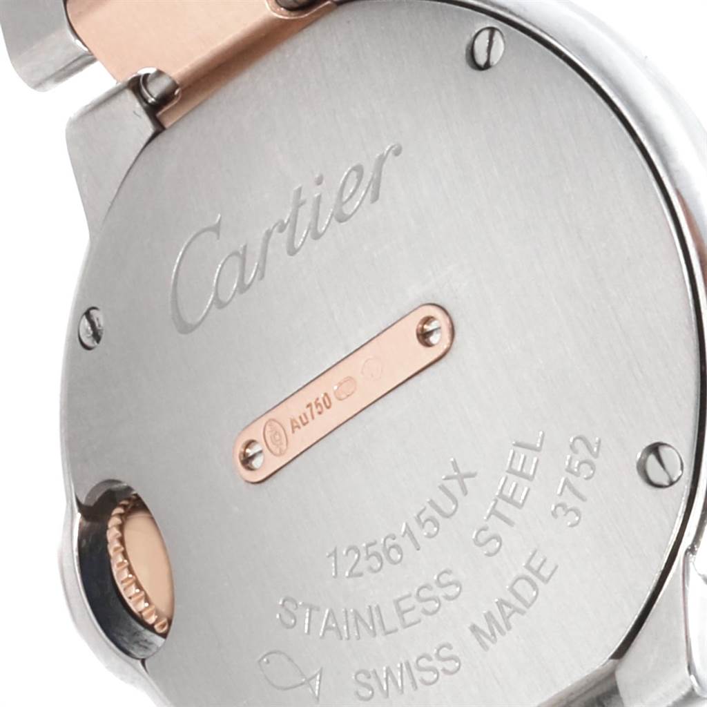 The image shows the back casing of a Ballon Bleu model watch by Cartier, highlighting its stainless steel and serial details.