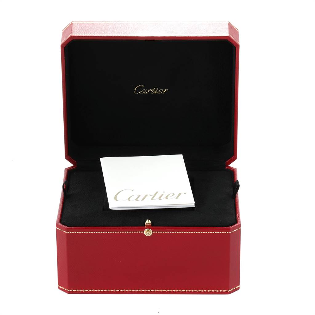 A Ballon Bleu by Cartier watch box is shown open with a booklet inside.