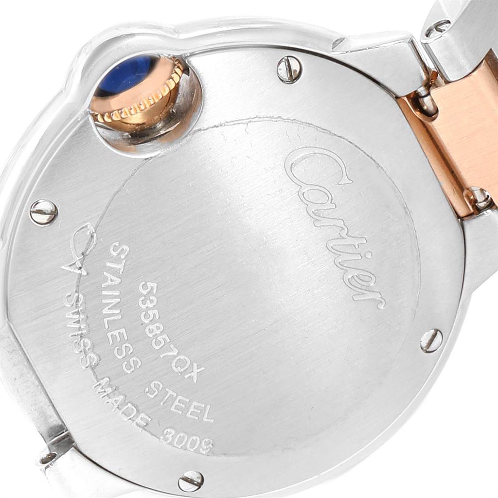 The image shows the back casing and crown of a Cartier Ballon Bleu W6920034 Women's Steel and Gold (two tone) Mother of Pearl Dial W6920034 Women's Steel and Gold (two tone) Mother of Pearl Dial watch at an angled view.