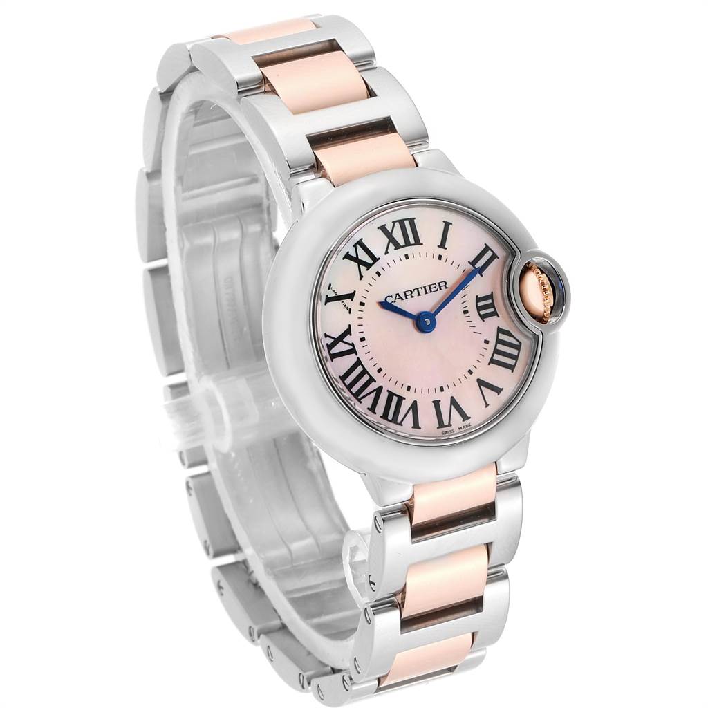 The image shows a Ballon Bleu model by Cartier at a three-quarter angle, highlighting the dial, bracelet, and crown.