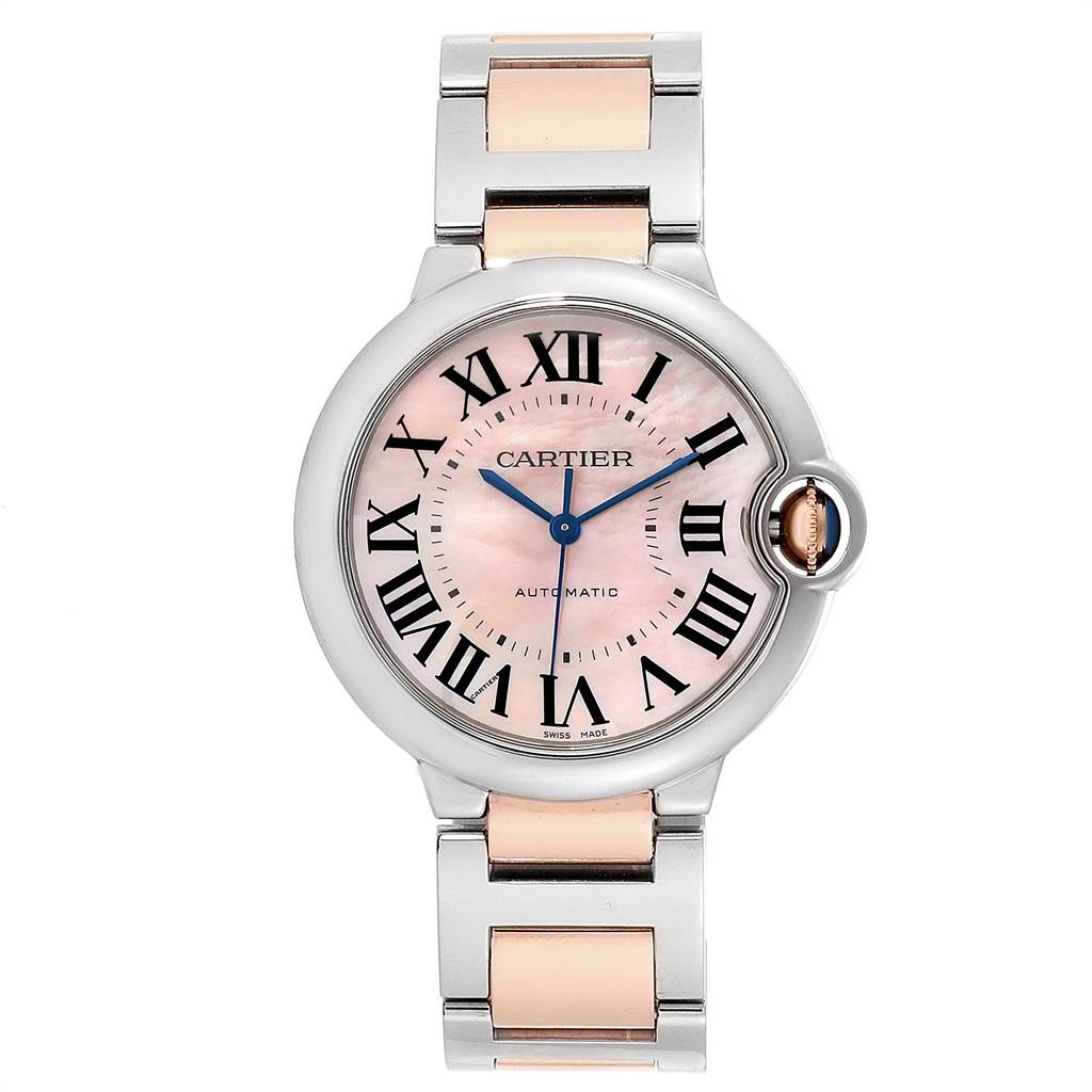 The image shows a frontal view of a Cartier Ballon Bleu W2BB0011 Women's Steel and Gold (two tone) Mother of Pearl Dial W2BB0011 Women's Steel and Gold (two tone) Mother of Pearl Dial watch with a two-tone bracelet and a pink dial with Roman numerals.