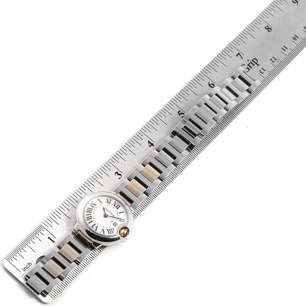The image shows a top-down view of a Cartier Ballon Bleu W69007Z3 Women's Stainless Steel Silver Dial W69007Z3 Women's Stainless Steel Silver Dial watch aligned next to a ruler.