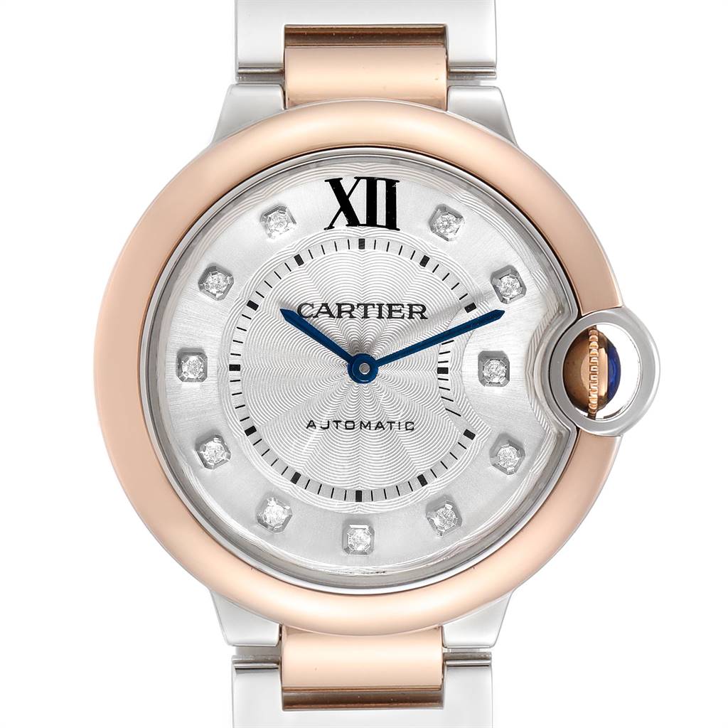 The image shows a close-up of the face and upper part of the Ballon Bleu de Cartier watch, highlighting its hour markers and hands.