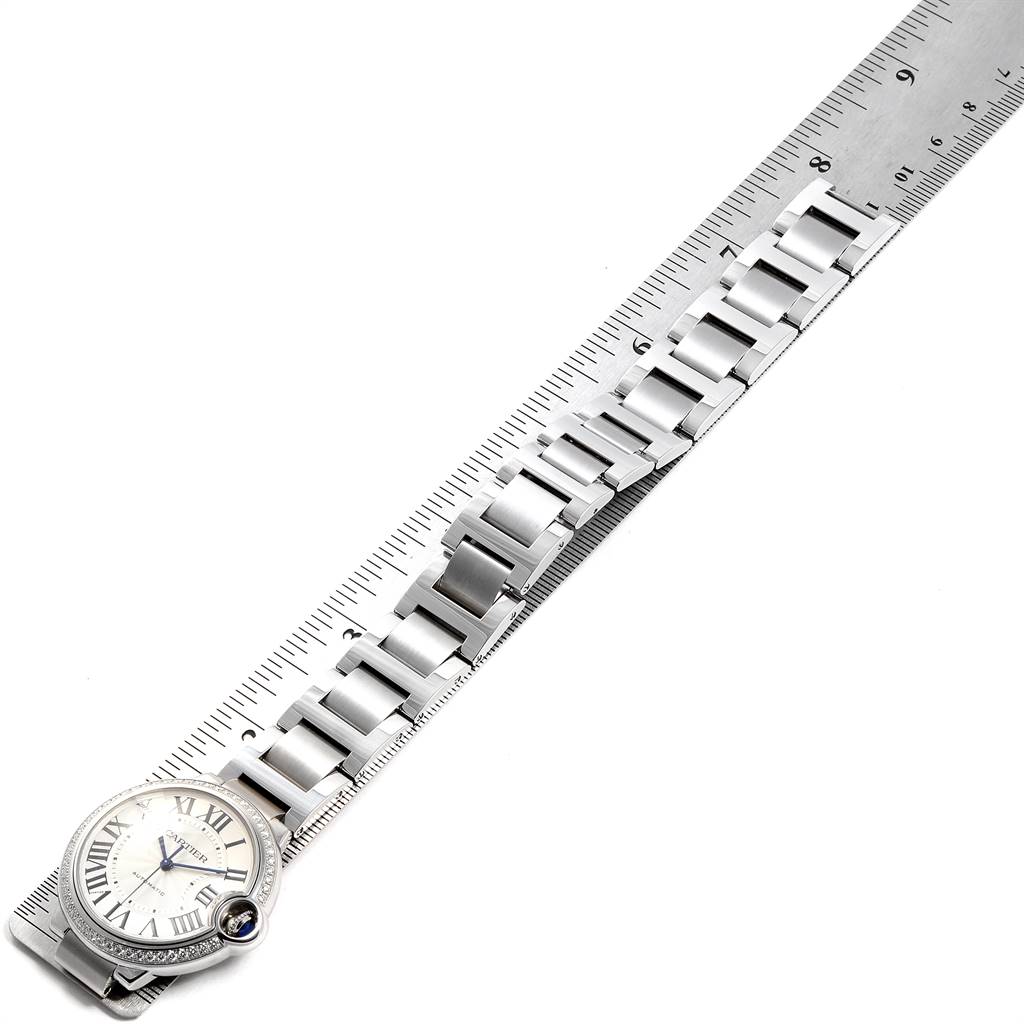 This image shows the face and bracelet of a Cartier Ballon Bleu W4BB0017 Women's Stainless Steel Silver Dial W4BB0017 Women's Stainless Steel Silver Dial watch, aligned with a ruler for measurement.