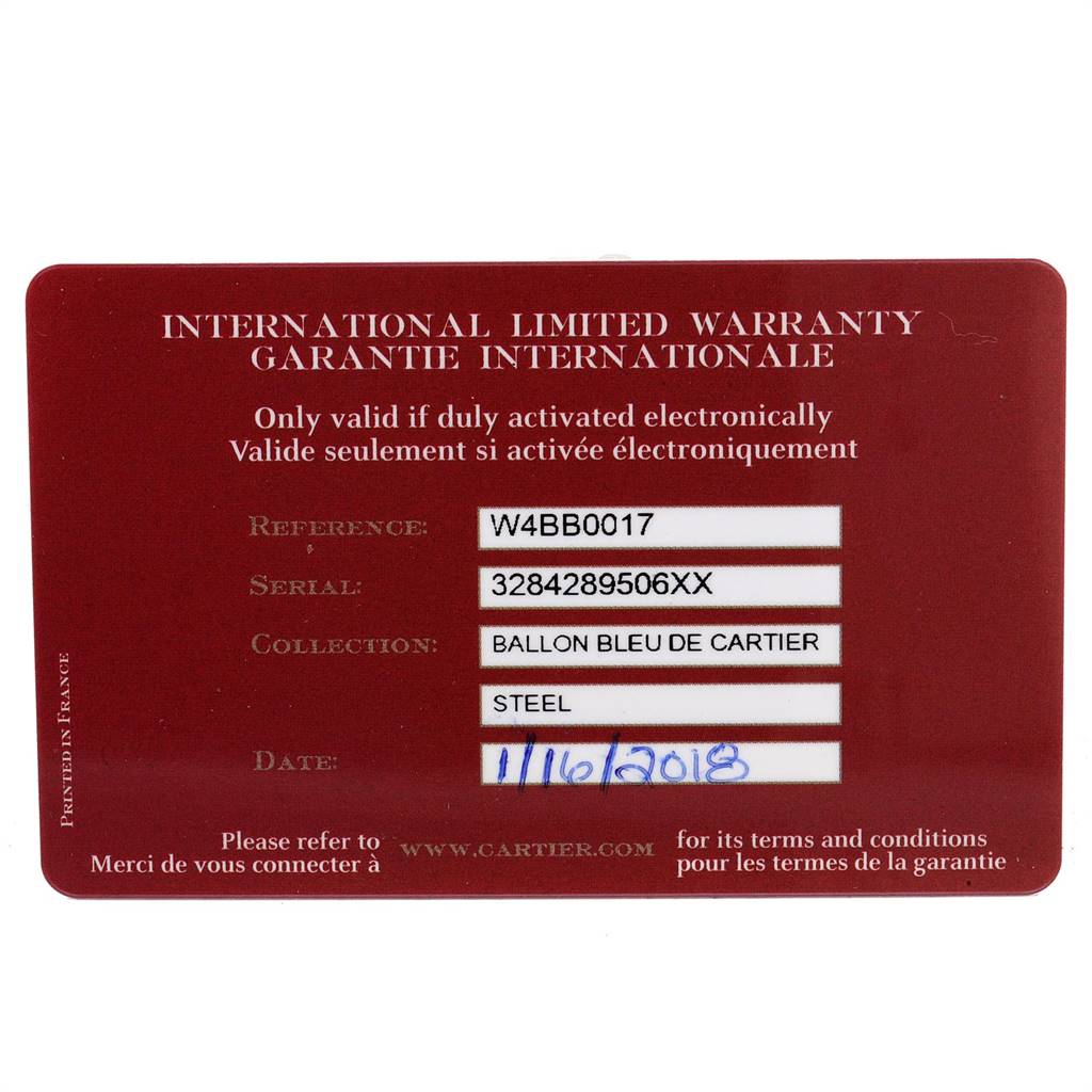 The image shows the warranty card for the Ballon Bleu de Cartier watch model, displaying reference, serial, collection, material, and date.