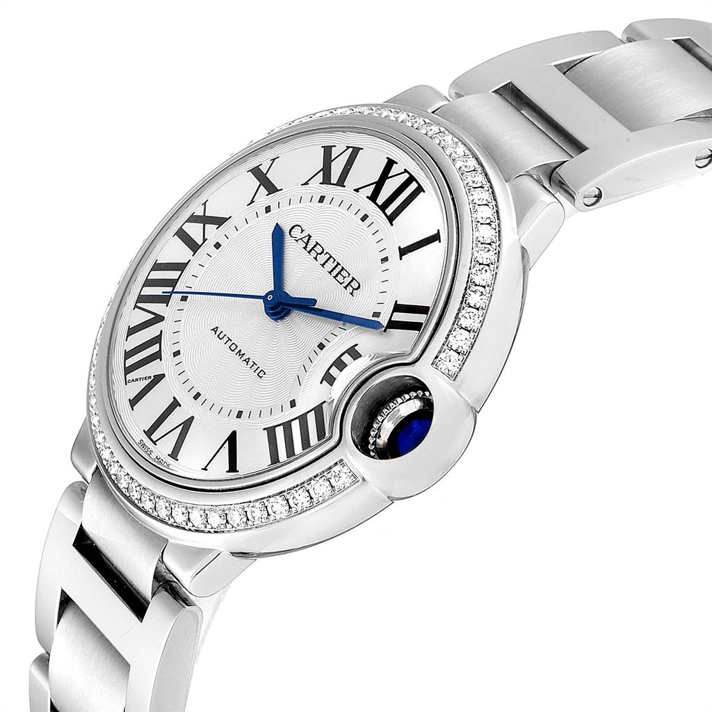The image shows a side angle of the Cartier Ballon Bleu W4BB0017 Women's Stainless Steel Silver Dial W4BB0017 Women's Stainless Steel Silver Dial watch, highlighting its round case, Roman numerals, and silver bracelet.